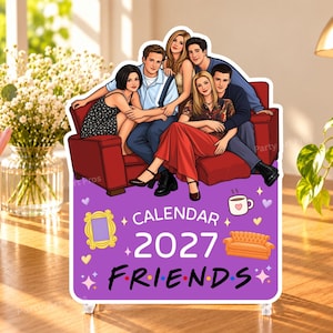 May include: A 2027 Friends calendar featuring a colorful illustration of the six main characters sitting on a red sofa. The purple background displays the text "CALENDAR 2027 FRIENDS" along with icons of a yellow picture frame, a coffee mug, and an orange sofa.