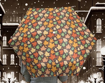 Paraguas de hojas otoñales para protegerse de la lluvia o del sol. Ideal para el otoño, como regalo para la fiesta de Acción de Gracias, una acogedora moda festiva que te mantiene seco