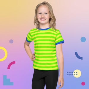 May include: A young person wearing a short-sleeved t-shirt with horizontal stripes in bright yellow and green. The shirt has blue trim on the collar and sleeves. The person is also wearing black leggings.