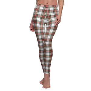 May include: White leggings with a red, green, and white plaid pattern.
