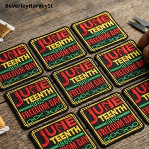 May include: Embroidered patches with the text "June 1865 Freedom Day" in red and green on a black background. The patches feature a fist graphic and chain links. The patches are square with a gold border.