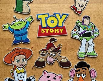 May include: Embroidered patches featuring characters from "Toy Story." The patches include Woody, Buzz Lightyear, Jessie, Rex, Hamm, Mr. Potato Head, Bullseye, and the Little Green Men, along with the "Toy Story" logo. Ideal for clothing.