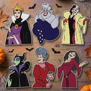 May include: Six flat, die-cut character cutouts featuring animated villains including the Evil Queen, Ursula, Cruella de Vil, Maleficent, Lady Tremaine, and Mother Gothel. The text Beverleyharveyst appears in the top left corner of the image.