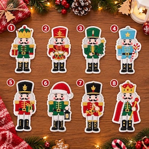 May include: Eight embroidered nutcracker patches numbered one to eight. Each figure features a distinct uniform, including crowns, hats, and accessories such as a gift, drum, Christmas tree, candy cane, lantern, trumpet, and scepter.