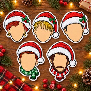 May include: Five embroidered patches featuring stylized character heads wearing red and white Santa hats with holly accents. The characters have distinct hair colors and styles, including red, blonde, and brown, with two figures wearing patterned winter scarves.