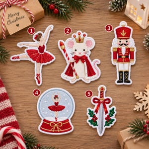 May include: Five embroidered patches featuring Christmas themes: a ballerina in a red tutu, a mouse wearing a crown and cape, a nutcracker soldier, a ballerina inside a snow globe, and a sword decorated with a red bow and holly leaves.