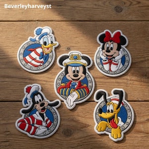 May include: Five embroidered patches featuring Disney characters Donald Duck, Mickey Mouse, Minnie Mouse, Goofy, and Pluto. Each character is depicted inside a circular gray porthole frame with a blue background, wearing nautical-themed clothing.