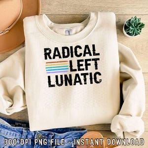 May include: A cream-colored sweatshirt with the text "RADICAL LEFT LUNATIC" in black lettering. A rainbow stripe design is above the word "LEFT".