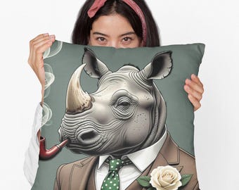 May include: A decorative pillow featuring a cartoon rhinoceros wearing a brown suit, a green polka dot tie, and a white rose. The rhinoceros is smoking a pipe and has a cloud of smoke behind it.