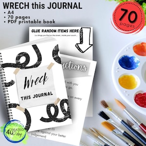May include: A black and white journal with the text "Wreck This Journal" on the cover. The journal has a spiral binding and is 70 pages long. The journal is surrounded by paintbrushes, a paint palette, and a green and yellow sticker with the text "CREATED 4U 2day".