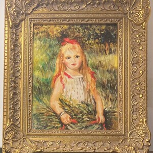 May include: A framed oil painting of a young girl with long blonde hair wearing a red ribbon and a white dress with red accents. She is standing in a field of green grass and holding a bouquet of flowers.