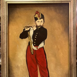 May include: A painting of a young boy in a red and black uniform playing a flute. The boy is wearing a red hat with gold trim. The painting is set against a brown background.
