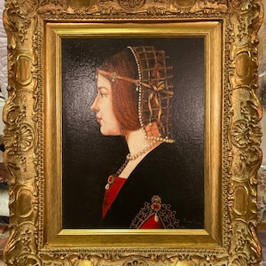 May include: A framed oil painting of a woman in profile, wearing a red and gold dress and a pearl necklace. Her hair is pulled back and she is wearing a gold headband with red jewels. The painting is set against a dark background.