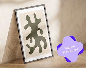 May include: A digital download of a printable art print featuring an abstract green shape on a beige background. The print is framed in a black frame.