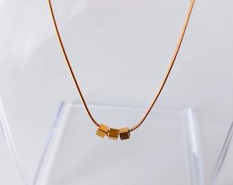 Minimalist gold stainless steel snake chain necklace with 3 cubes, affordable jewellery