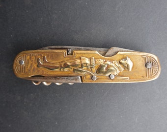 WW1 French 'Depose' brass pocket knife with huntsman and stork