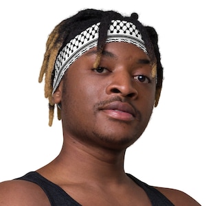 A man with dreadlocks wearing a Keffiyeh-Inspired Headband in Black and White to Show Palestinian Solidarity and Gaza Support,