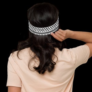 Woman wearing a keffiyeh-inspired headband
