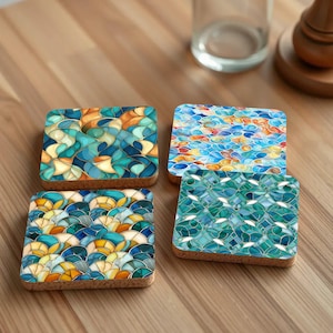 May include: Set of four blue, green, and yellow patterned coasters with a cork backing. The coasters feature a geometric design reminiscent of stained glass.