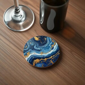 Close-up of a coaster with deep navy blue swirls, gold veining, and a luxurious marbled finish, resembling polished lapis lazuli.
