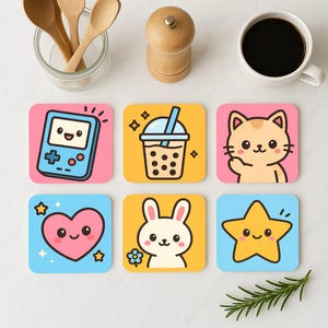 May include: Set of six colorful square coasters with cute cartoon designs. The coasters feature a video game console, a boba tea, a cat, a bunny, a heart, and a star.