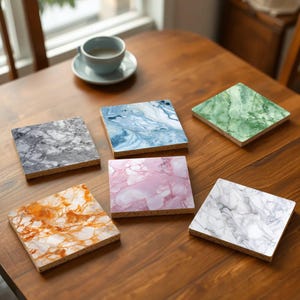 May include: Six different coasters with marble-like patterns. The coasters are made of cork and have a variety of colours, including grey, blue, green, pink, and orange.