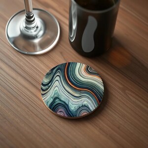 Close-up of a coaster with deep emerald and turquoise marbled waves, reminiscent of malachite stone with its fluid, rich green textures