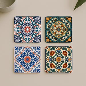 May include: Set of four square coasters with intricate, colorful tile designs. Each coaster features a unique pattern in shades of blue, red, green, and yellow. The coasters are likely made of ceramic or a similar material, offering a decorative and functional accessory.
