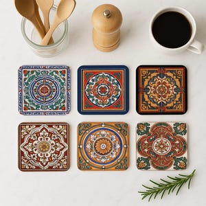 May include: Set of six colorful ceramic coasters with intricate geometric patterns. The coasters feature a variety of colors, including blue, red, yellow, and green. Each coaster has a unique design, but they all share a similar style.