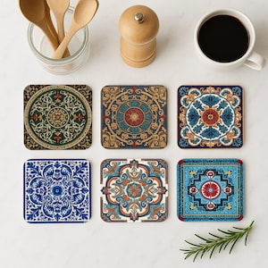 May include: Six square coasters with detailed, colourful, and ornate designs. The coasters feature patterns in shades of blue, green, red, and gold. A cup of coffee, wooden spoons, and a pepper grinder are also visible.