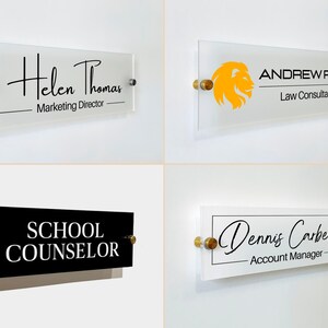 May include: Four rectangular office door signs mounted with gold-toned hardware. The signs feature names and titles including Helen Thomas Marketing Director, Andrew Reid Law Consultant with a lion logo, School Counselor, and Dennis Carbell Account Manager.