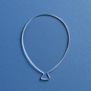 May include: A silver wire shaped like a balloon on a blue background.