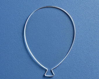 May include: A silver wire shaped like a balloon on a blue background.