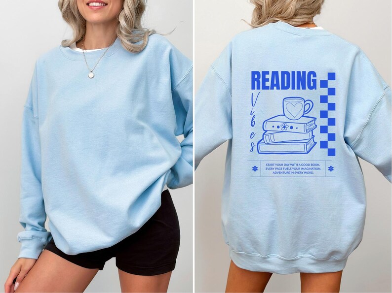a woman wearing a blue sweatshirt with reading on it