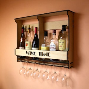 May include: A wooden wall-mounted wine rack with a black frame and glass holders. The rack has two shelves and a sign that says "WINE TIME".