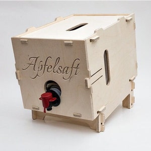 May include: A wooden box with a spout for dispensing juice. The box is labeled "Apfelsaft" which is German for apple juice.