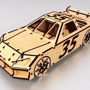 May include: A wooden model of a racing car with the number 35 on the side. The car is made of plywood and has a detailed design.