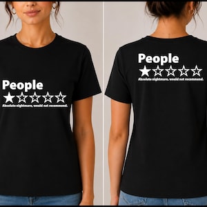 May include: A black short-sleeved t-shirt featuring the white text People above a single solid star and four empty star outlines, followed by the text Absolute nightmare, would not recommend. The design is displayed on the front and back.