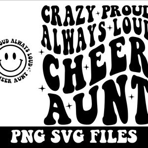 May include: Black and white graphic design with the text "CRAZY PROUD ALWAYS LOUD CHEER AUNT" in a retro font style. The text is arranged in a circular pattern with stars around the edges. The text "PNG SVG FILES" is at the bottom of the design.