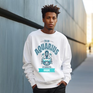 May include: White sweatshirt with a blue and white graphic of a man with the text "I'm an Aquarius, of course I'm unique."