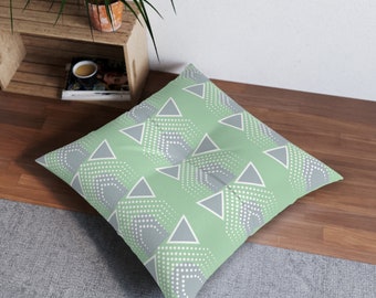 Grünes abstraktes Bodenkissen graues Dreieck formt Bodensitzmöbel Afrikanisch inspiriertes Muster bequemes Kissen einzigartig gemusterter Puff fallen auf