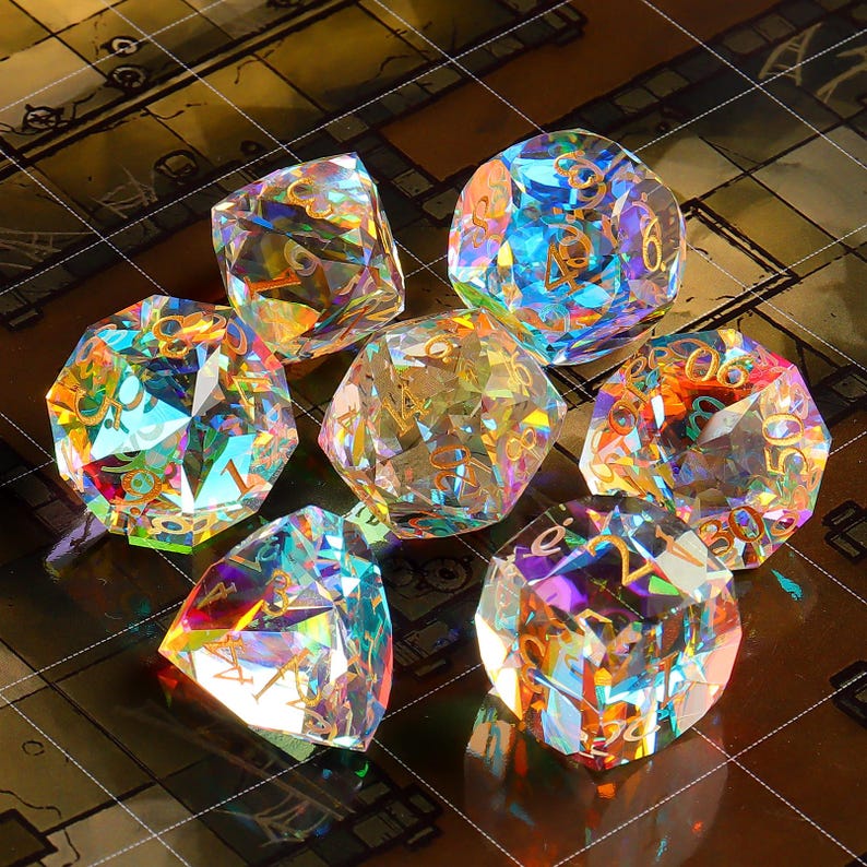 May include: Seven iridescent dice with rainbow colors and gold numbers. The dice are made of clear glass and have a faceted design.