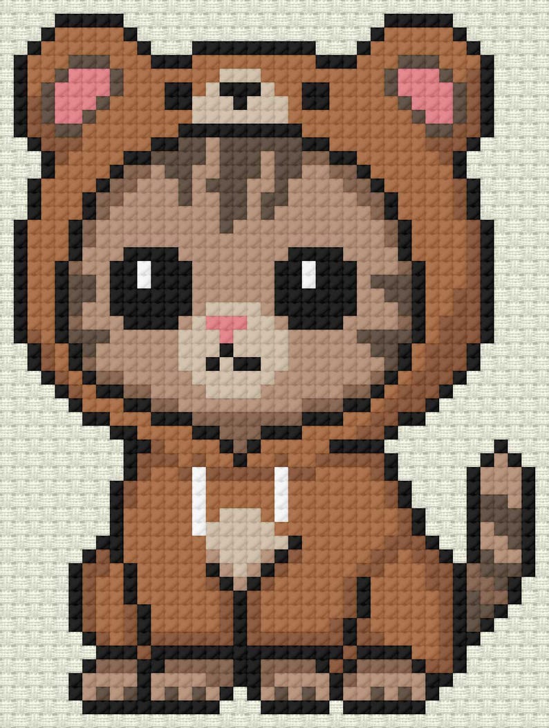 May include: A pixelated image of a cat wearing a brown bear costume. The cat has large black eyes, a pink nose, and a brown and tan striped pattern on its face. The bear costume has brown ears with pink inner ears and a white drawstring.