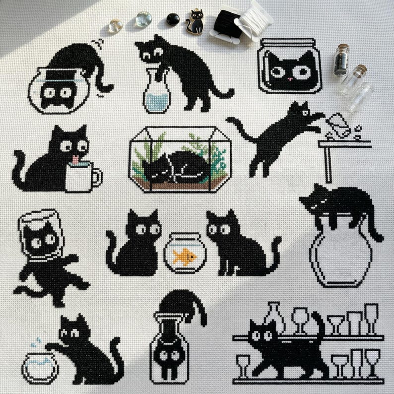 May include: A cross-stitch pattern featuring various black cat designs interacting with objects like fishbowls, vases, and a coffee mug. The cats are depicted in playful poses, with a few small embellishments in the upper right corner.