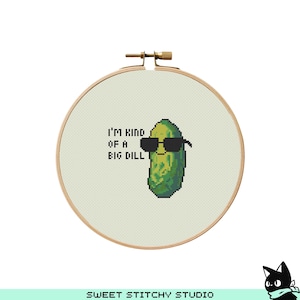 May include: A cross-stitch pattern featuring a green pickle wearing sunglasses with the text "I'm kind of a big dill".
