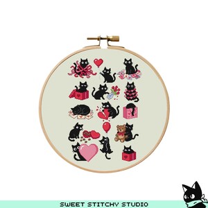 May include: A cross-stitch embroidery hoop featuring various black cat designs with hearts, gifts, and balloons. The cats are in different poses, some holding flowers or teddy bears. The background is a light beige fabric, and the hoop is made of wood.