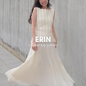 May include: A sleeveless cream-colored crochet top featuring a wavy, textured stitch pattern and a scalloped neckline. The text ERIN crochet top pattern is printed in white across the center of the garment, which is paired with a long white skirt.