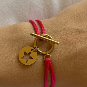 pink cord bracelet, gold hook