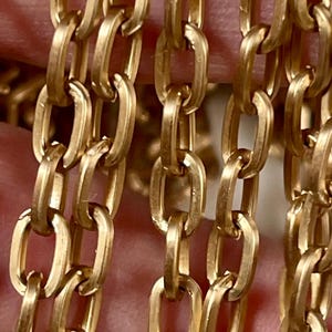 Raw Brass, No Plating Smooth Satin Oval Cable Chain. 4.37 x 7.29, Soft, Natural Brass Color.  Excellent Quality. Priced by the foot