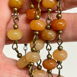 8mm x 5mm, Light Umber/Ochre Color Stones With Small Brass Colored Beads, Bead Chain.  Priced per foot